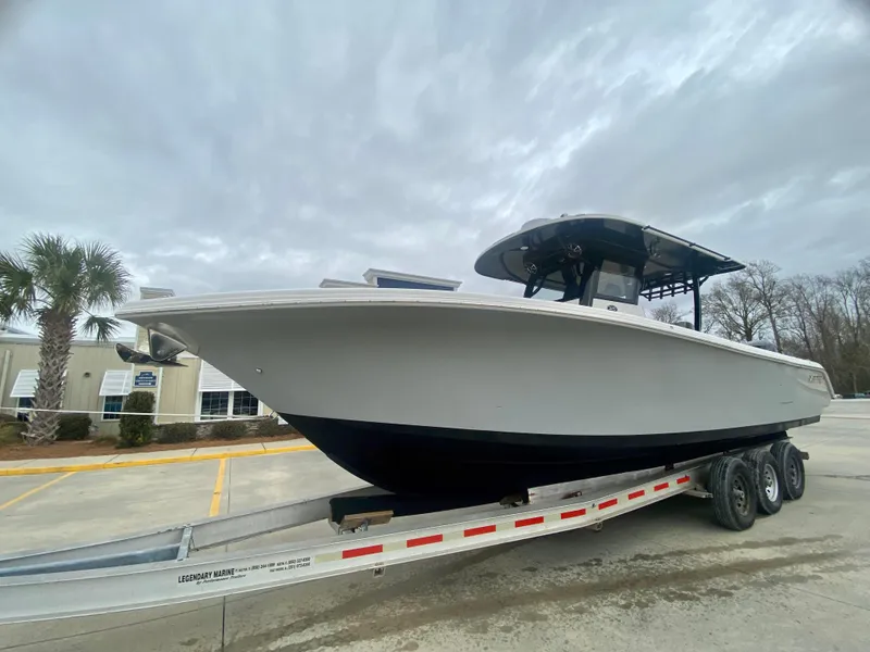 Slide: The Image of 2022 Sea Pro 320 DXL boat on a trailer, side view. - 3