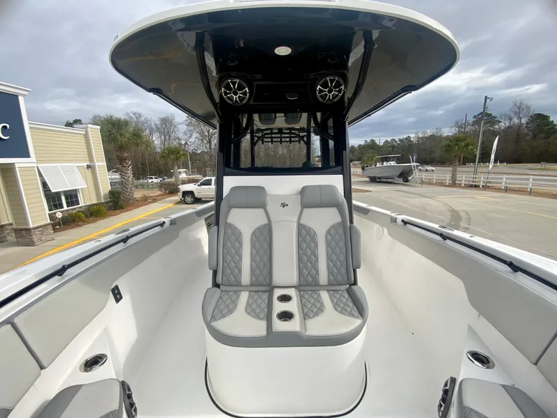 Slide: The Image of 2022 Sea Pro 320 DXL boat interior with dual seats and overhead speakers. - 34