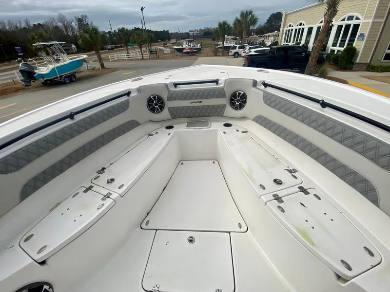 Slide: The Image of 2022 Sea Pro 320 DXL boat interior with seating and storage compartments. - 37