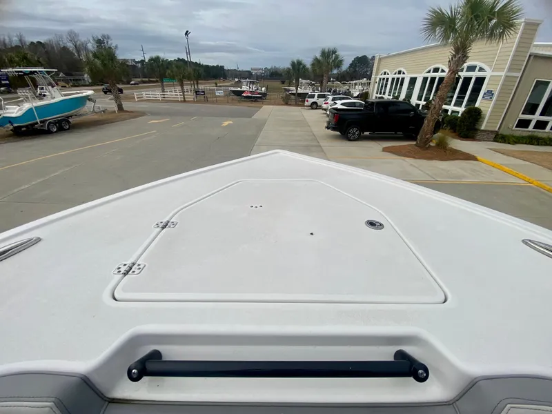 Slide: The Image of 2022 Sea Pro 320 DXL boat at a marina, view from the bow. - 39