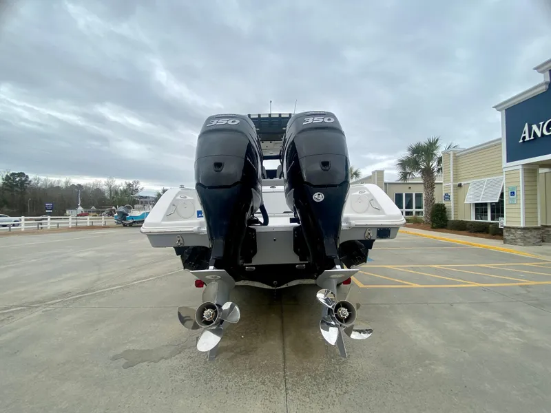 Slide: The Image of 2022 Sea Pro 320 DXL boat with twin 350 horsepower engines, rear view. - 5