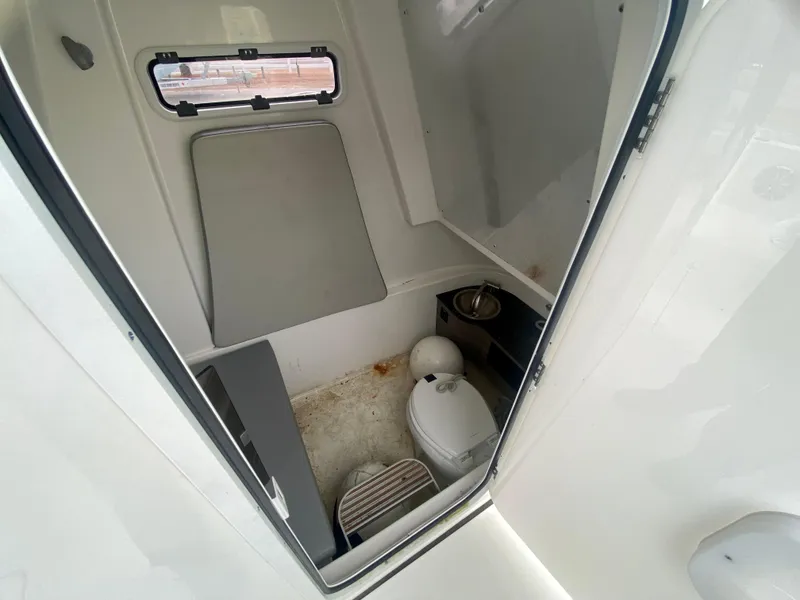 Slide: The Image of 2022 Sea Pro 320 DXL boat interior bathroom with toilet and sink. - 29