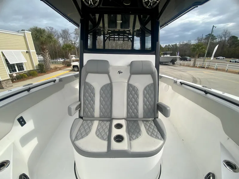 Slide: The Image of 2022 Sea Pro 320 DXL boat with dual cushioned seats and cup holders. - 32