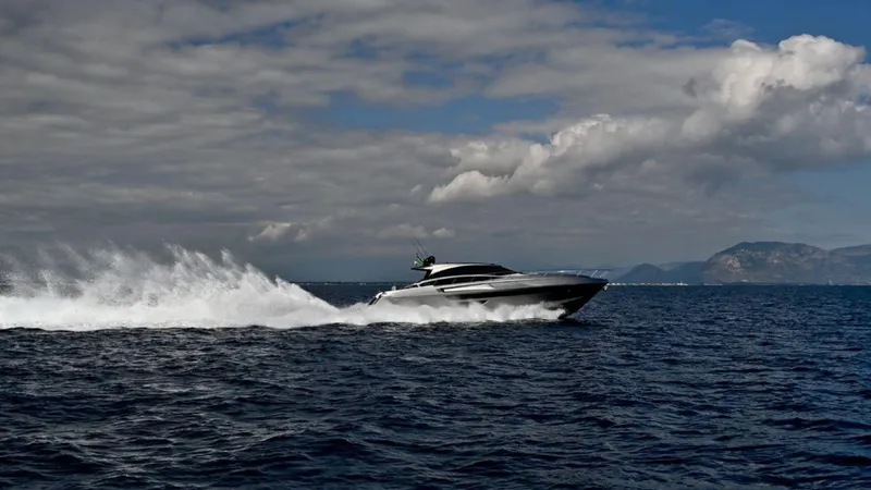 Slide: The Image of 2024 Rizzardi IN SIX yacht cruising on open water under cloudy sky. - 2