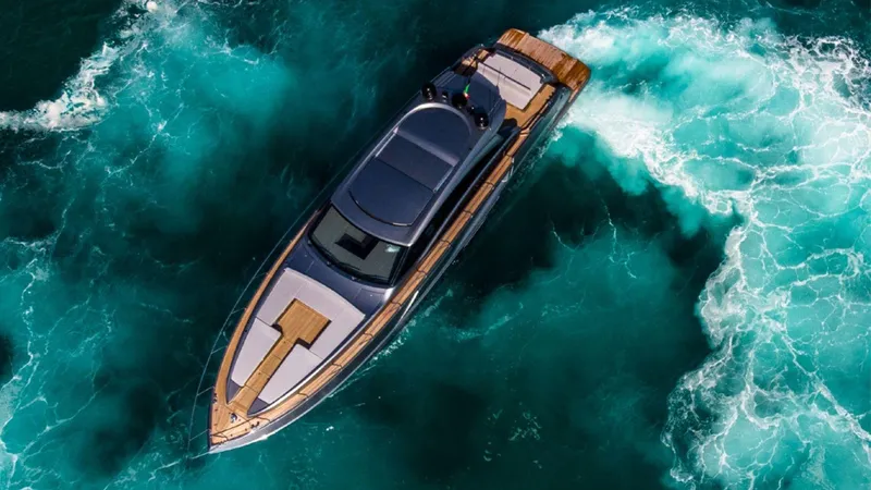 Slide: The Image of Aerial view of 2024 Rizzardi IN SIX yacht cruising through turquoise waters. - 3