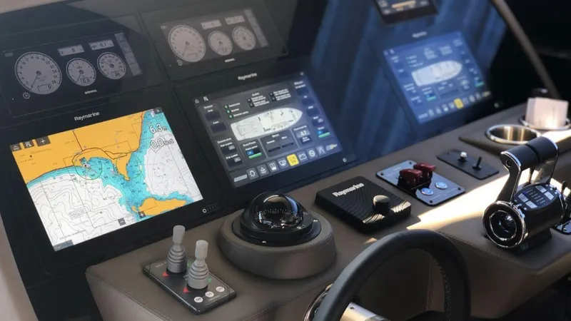 Slide: The Image of Control panel of the 2024 Rizzardi IN SIX yacht with navigation screens and controls. - 8