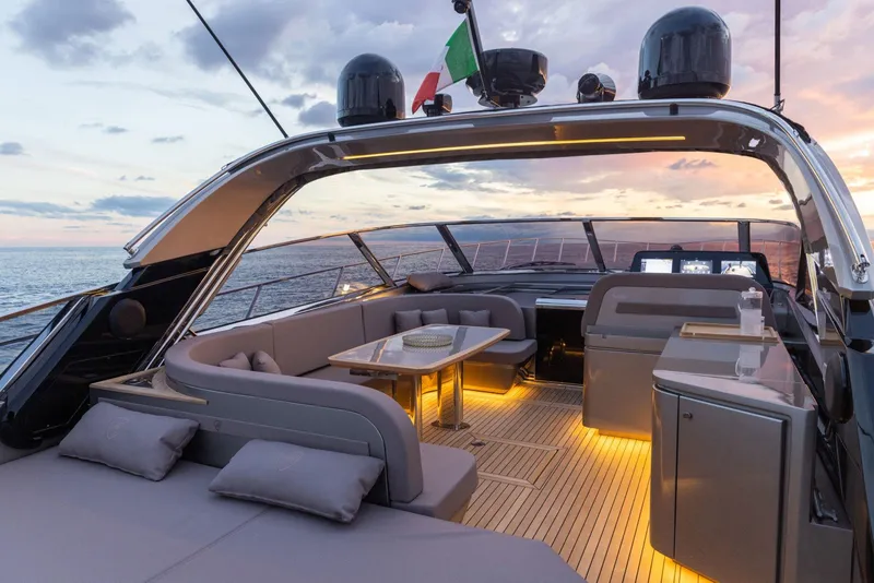 Slide: The Image of Luxurious 2024 Rizzardi GR SESSANTATRE yacht interior at sunset, featuring elegant seating and ambient lighting. - 10