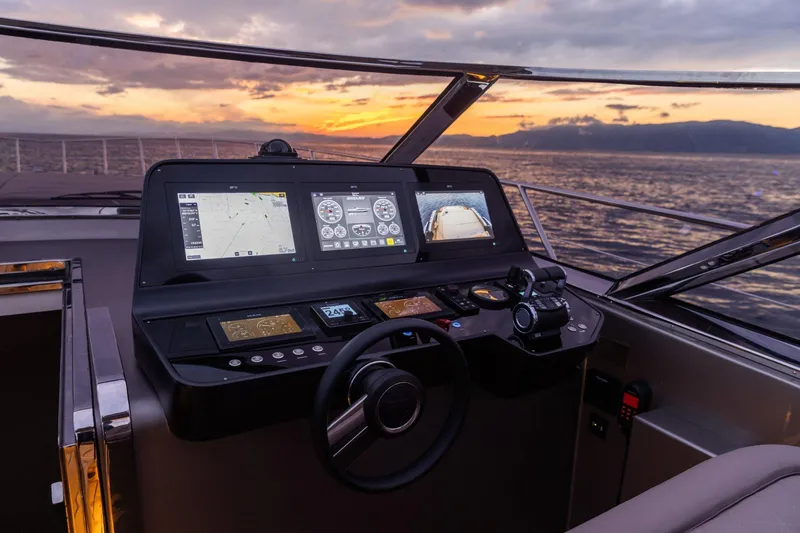 Slide: The Image of 2024 Rizzardi GR SESSANTATRE yacht helm with advanced navigation systems at sunset. - 12