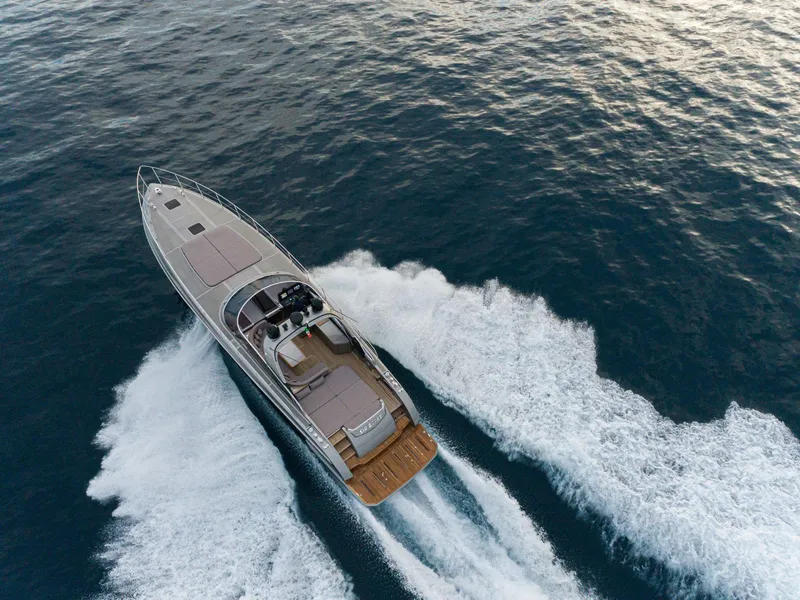 Slide: The Image of 2024 Rizzardi GR SESSANTATRE luxury yacht cruising on open water. - 2