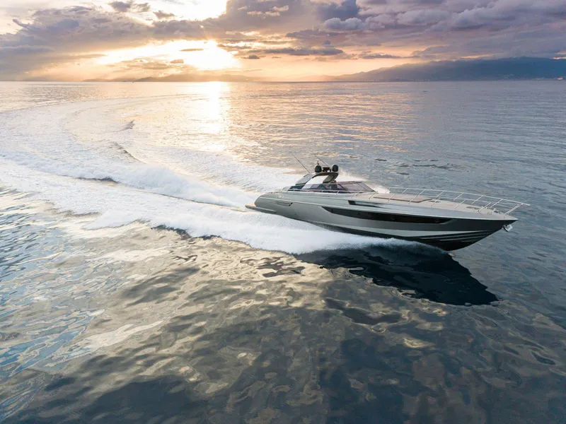 Slide: The Image of 2024 Rizzardi GR SESSANTATRE luxury yacht cruising at sunset on open water. - 5