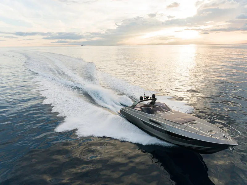 Slide: The Image of 2024 Rizzardi GR SESSANTATRE luxury yacht cruising on open water at sunset. - 6