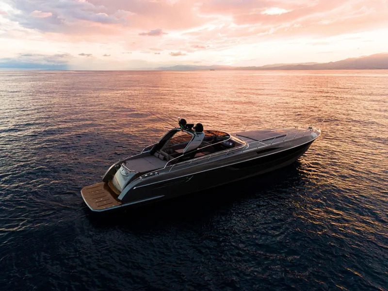 Slide: The Image of 2024 Rizzardi GR SESSANTATRE luxury yacht at sunset on calm waters. - 8