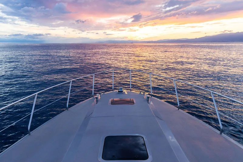 Slide: The Image of Bow of 2024 Rizzardi GR SESSANTATRE yacht at sunset on open sea. - 9