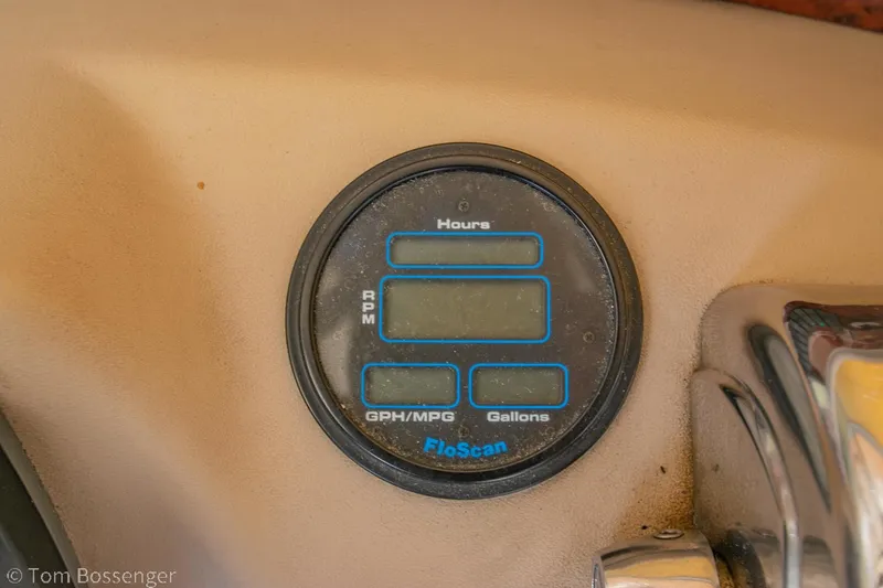 Slide: The Image of Instrument panel of a 1999 Sea Ray 340 Sundancer boat, featuring a FloScan gauge. - 28