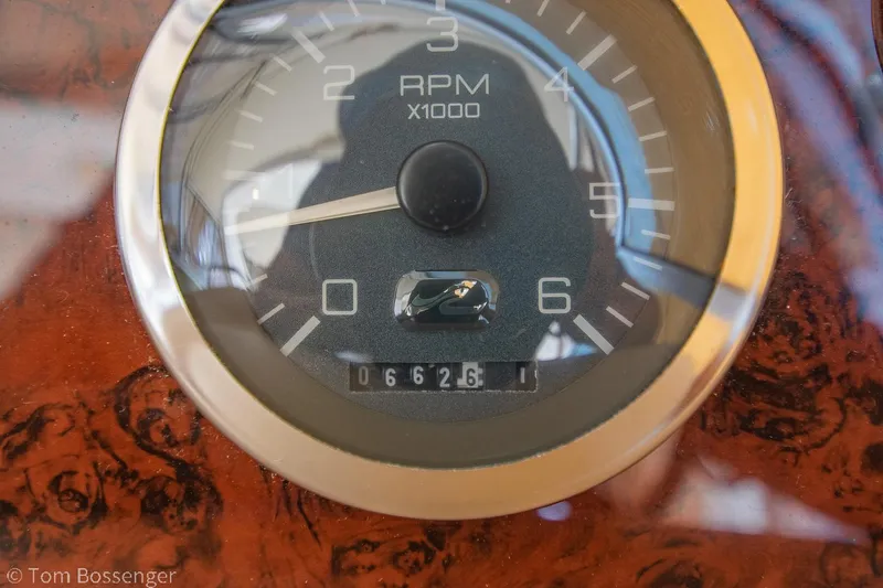 Slide: The Image of Tachometer of 1999 Sea Ray 340 Sundancer showing 6,626 RPM on a wooden dashboard. - 35