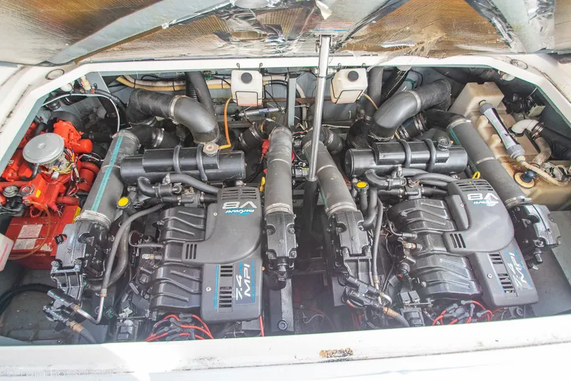 Slide: The Image of Engine compartment of a 1999 Sea Ray 340 Sundancer with twin inboard motors. - 36