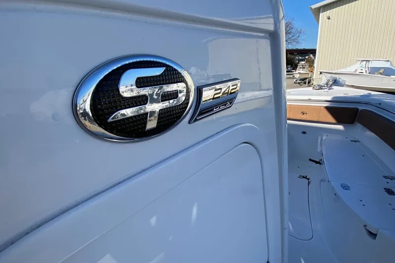 Slide: The Image of 2024 Sea Pro 242 boat emblem and interior view. - 10