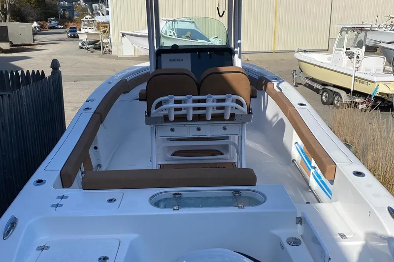 Slide: The Image of 2024 Sea Pro 242 boat interior with seating and console. - 4