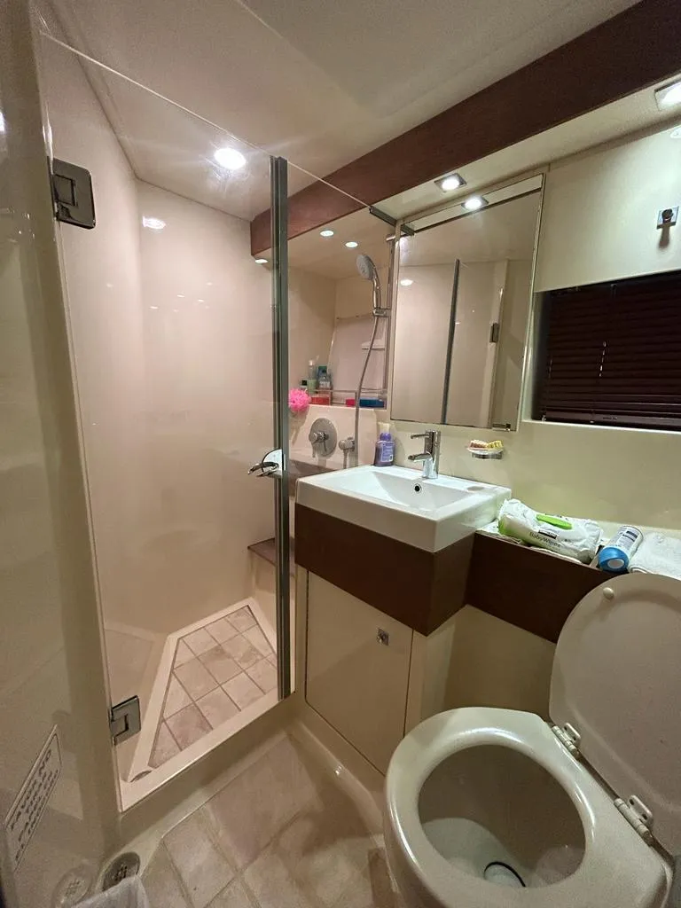 Slide: The Image of Bathroom interior of 2013 Sea Ray 410 Sundancer yacht with shower and sink. - 10