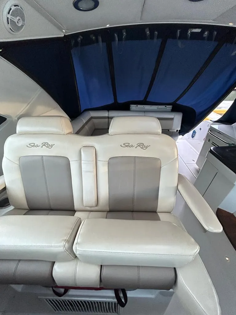 Slide: The Image of 2013 Sea Ray 410 Sundancer interior with plush seating and elegant design. - 5