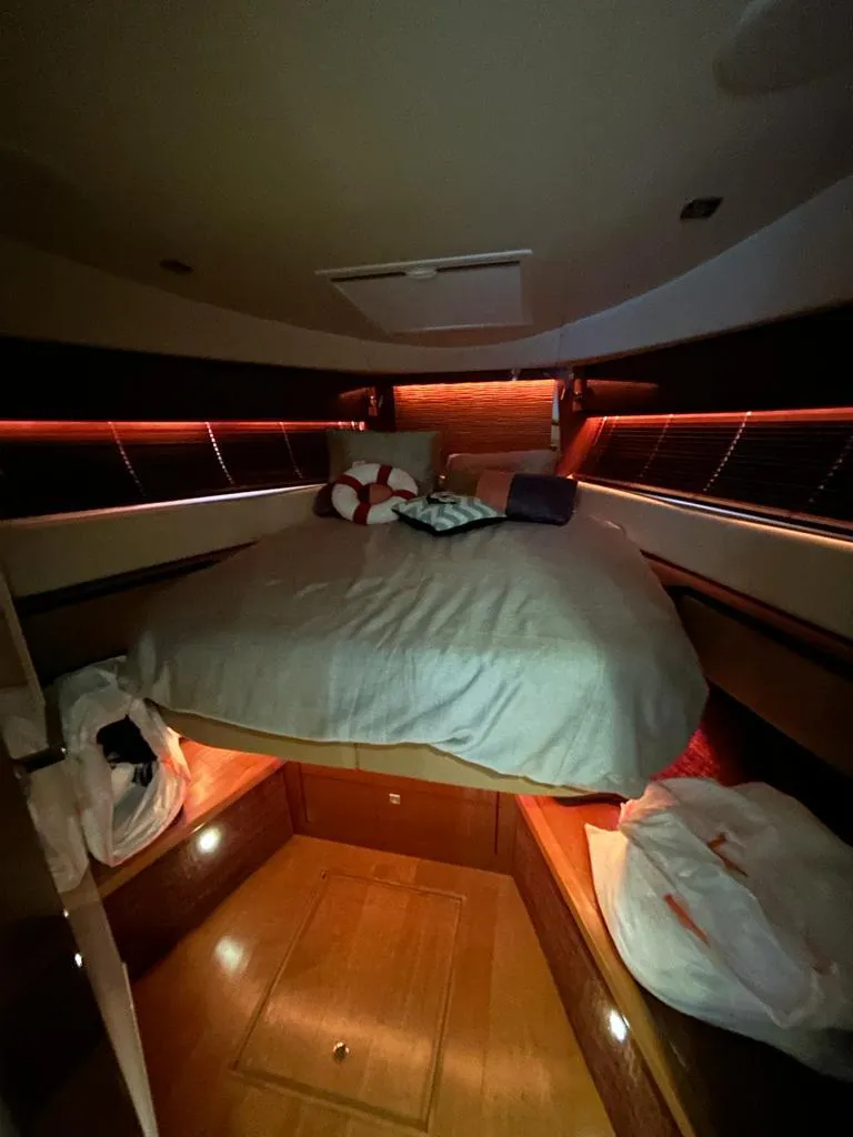 Slide: The Image of Luxurious cabin interior of 2013 Sea Ray 410 Sundancer yacht with ambient lighting. - 9