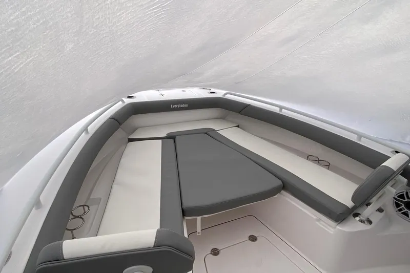 Slide: The Image of 2023 Everglades 273 boat interior with cushioned seating and spacious layout. - 4