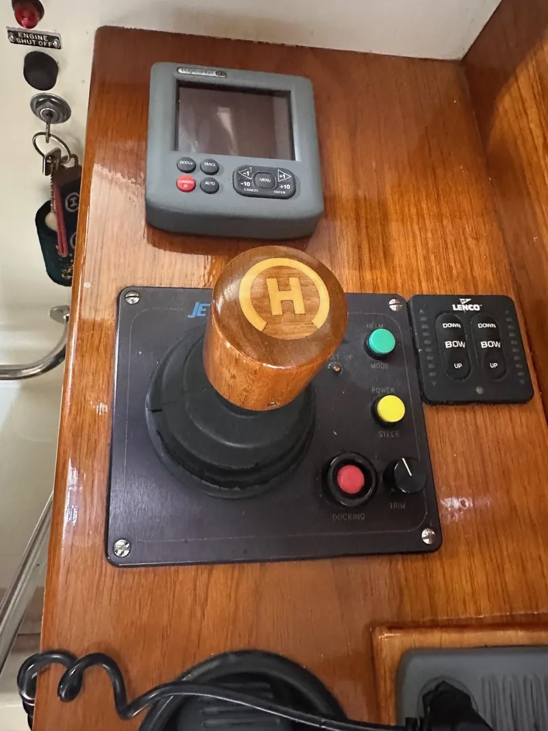 Slide: The Image of Control panel of a 2001 Hinckley 36 Picnic Boat with joystick and navigation display. - 5