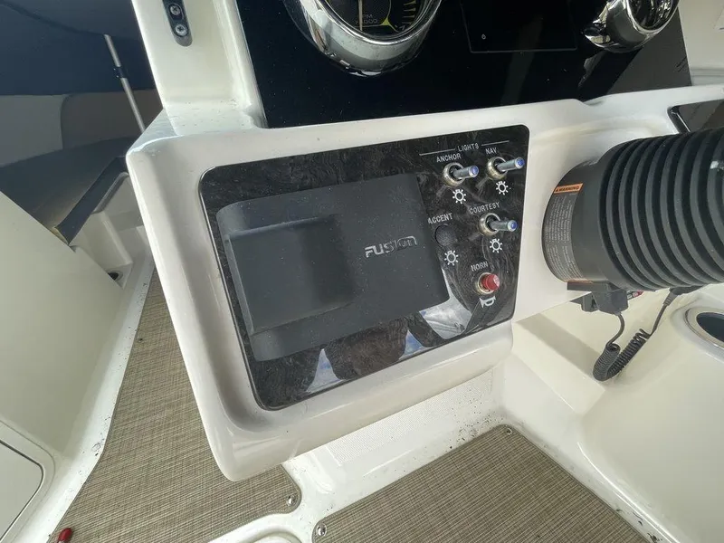 Slide: The Image of Control panel of a 2021 Sea Ray 210 SPX OB boat with Fusion audio system. - 4