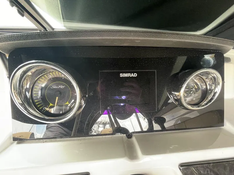 Slide: The Image of Dashboard of a 2021 Sea Ray 210 SPX OB boat with Simrad display. - 8