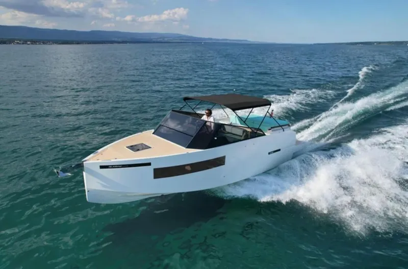 Slide: The Image of 2024 De Antonio Yachts D28 Cruiser speeding on open water. - 1