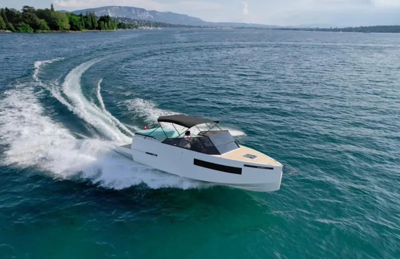 Slide: The Image of 2024 De Antonio Yachts D28 Cruiser speeding on open water. - 10