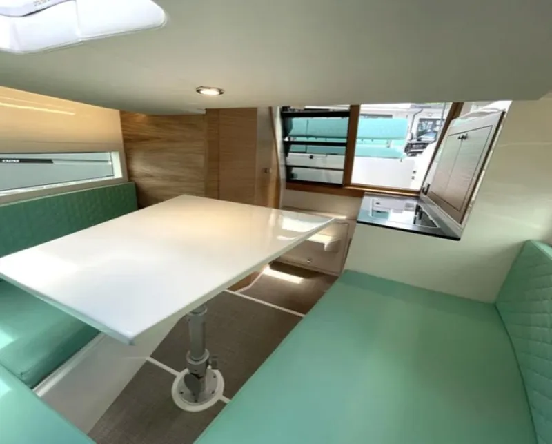 Slide: The Image of Interior of 2024 De Antonio Yachts D28 Cruiser with modern dining area. - 3