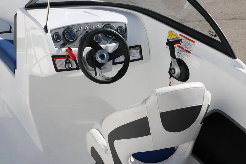 Slide: The Image of 2020 Tahoe 450 TS boat cockpit with steering wheel and control panel. - 14