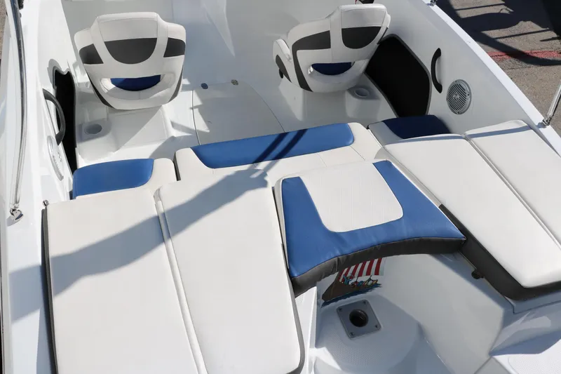 Slide: The Image of 2020 Tahoe 450 TS boat interior with white and blue seating. - 16