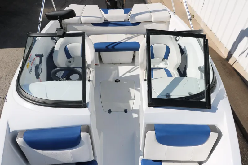 Slide: The Image of 2020 Tahoe 450 TS boat interior with blue and white seating. - 17