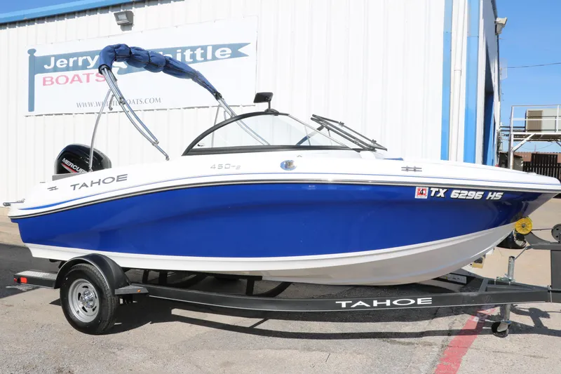 Slide: The Image of 2020 Tahoe 450 TS boat on trailer at dealership. - 2