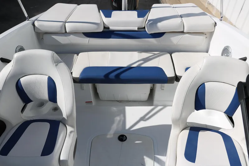 Slide: The Image of 2020 Tahoe 450 TS boat interior with white and blue seating. - 22