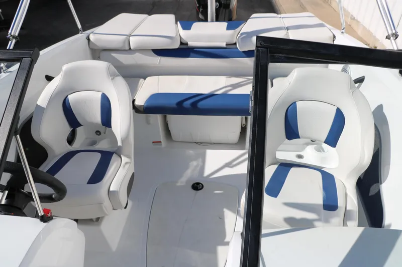 Slide: The Image of 2020 Tahoe 450 TS boat interior with white and blue seating. - 23
