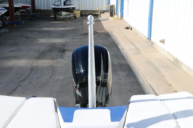 Slide: The Image of Rear view of a 2020 Tahoe 450 TS boat with an outboard motor. - 24