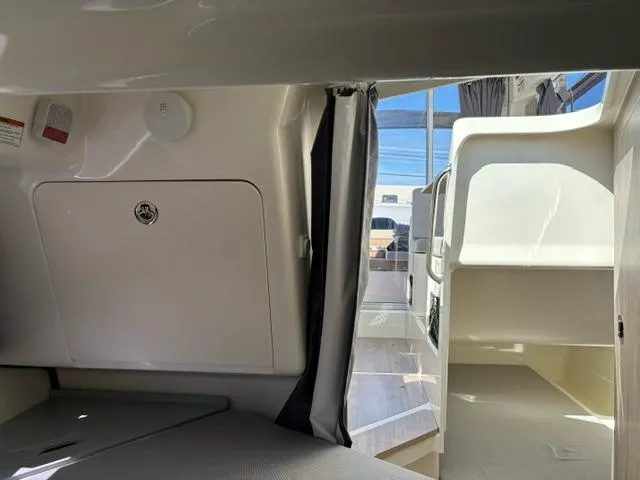 Slide: The Image of Interior cabin of 2024 Bayliner TROPHY 25 EXPLORER boat with seating and storage. - 17