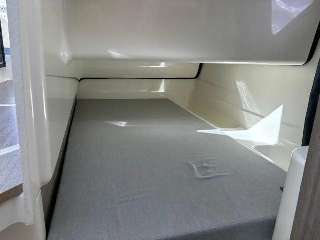 Slide: The Image of Interior cabin of 2024 Bayliner TROPHY 25 EXPLORER with a comfortable sleeping area. - 18