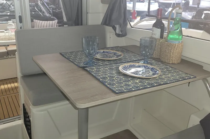 Slide: The Image of 2024 Bayliner TROPHY 25 EXPLORER interior dining area with table setting. - 46