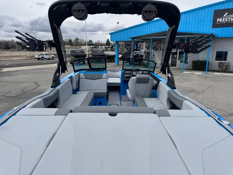 Slide: The Image of 2024 MasterCraft NXT23 boat interior with spacious seating and modern design. - 6