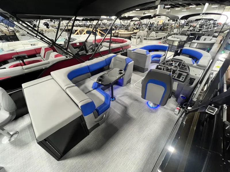 Slide: The Image of 2024 Berkshire 25RFC STS pontoon boat interior with modern seating and control console. - 11