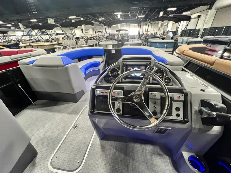 Slide: The Image of 2024 Berkshire 25RFC STS pontoon boat interior with modern helm and seating. - 15