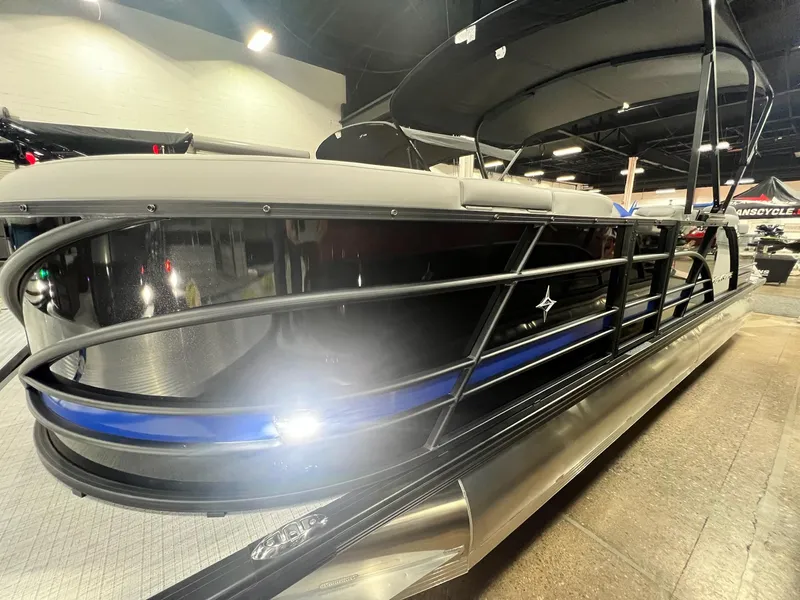 Slide: The Image of 2024 Berkshire 25RFC STS pontoon boat on display indoors. - 17