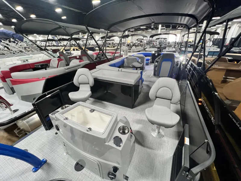 Slide: The Image of 2024 Berkshire 25RFC STS pontoon boat interior at a boat show. - 18