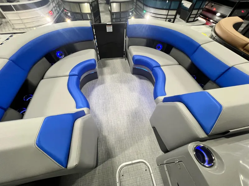 Slide: The Image of 2024 Berkshire 25RFC STS boat interior with blue and gray seating. - 19