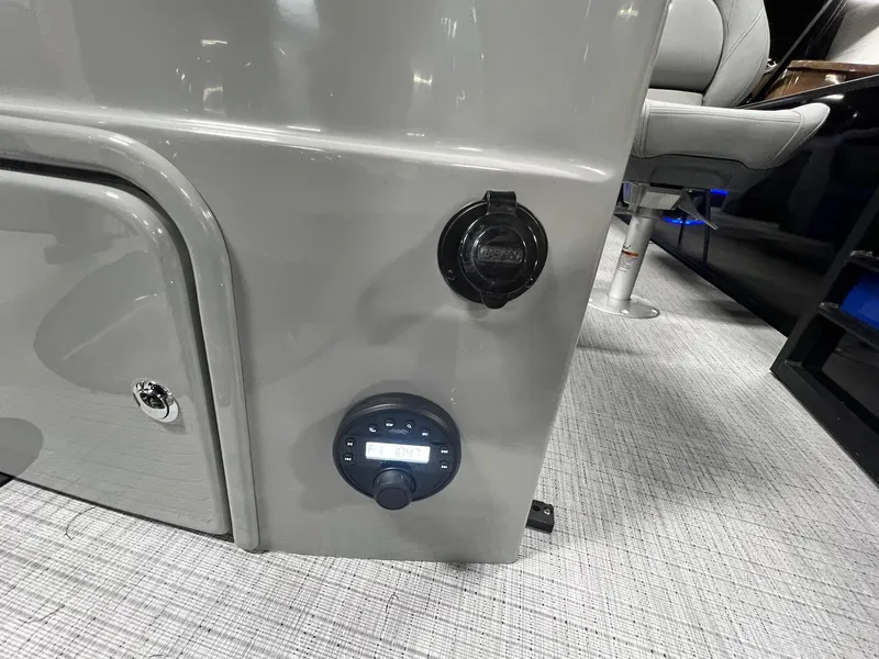 Slide: The Image of Control panel and outlet on 2024 Berkshire 25RFC STS boat interior. - 22
