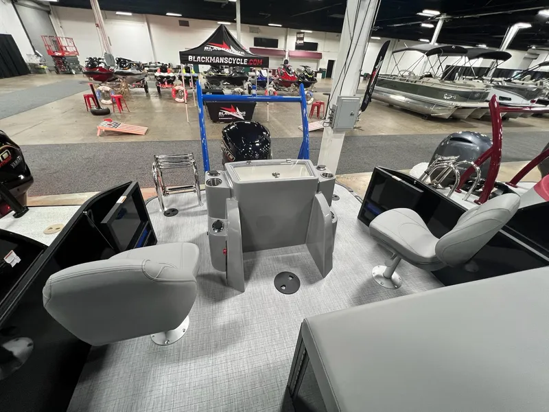 Slide: The Image of 2024 Berkshire 25RFC STS pontoon boat interior at a boat show. - 23